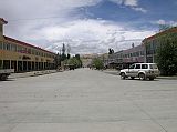 Tibet Guge 02 Tholing 02 Main Street Once a Tibetan town full of nomads, Tholing (3550m, Ch. Zanda) is now a small Chinese military town. Tholing has a wide main street lined with concrete-block shops whose goods tumble into the street.